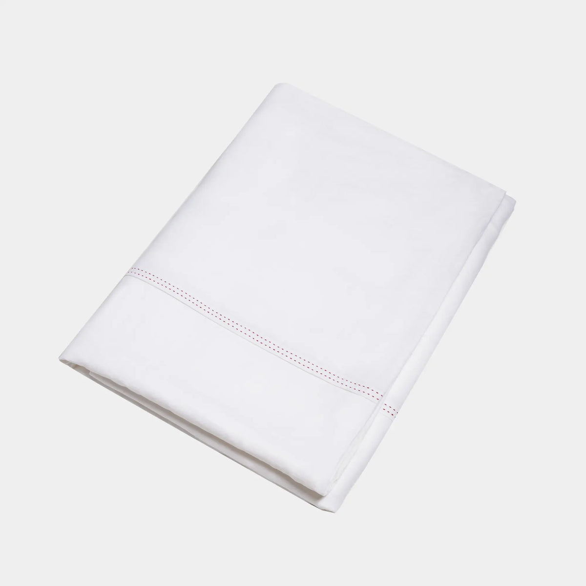 Housse de couette Éveil Blanc en lin lavé français pliée sur fond blanc